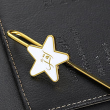 Load image into Gallery viewer, The Iqra Bookmark makes for a delightful and enduring gift with its elegant and sturdy spine which flows into a star that cradles the first word revealed to our Prophet Muhammad (Peace Be upon Him) from Allah SWT was “Iqra” which means to Read! Measuring 14cm (5.5 inches) tall, and nestled in an opulent box, it’s sure to bring a smile to your face each time you recite the Noble Quran. Available in Gold