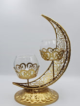Load image into Gallery viewer, This Ramadan light up your home with this beautiful and elegant candle holder. The metal holder is in the shape of the Crescent Moon and two small candle holder sits in the middle.